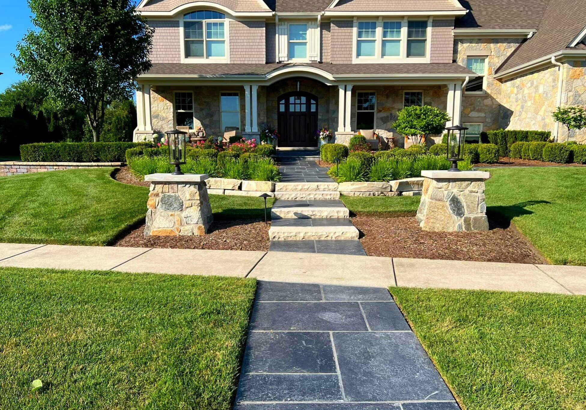 Beautifully landscaped front yard designed and installed by Arellano Landscaping, enhancing curb appeal with expert craftsmanship