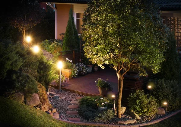Professional installation of energy-efficient LED landscape lighting by Arellano Landscaping enhancing St. Charles home