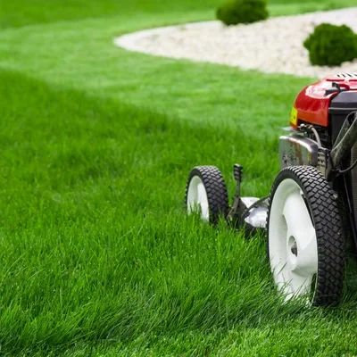 Arellano Landscaping team performing comprehensive lawn mowing with attention to detail in St. Charles, IL